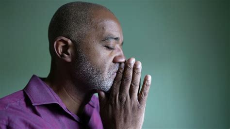 Premium Photo A Worried Senior Black Man Praying To God Seeking Help