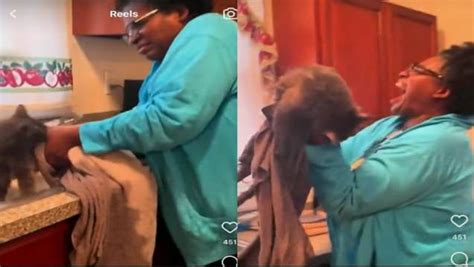 Fighting For Her Life Woman Attempts To Give Her Cat A Bath In The