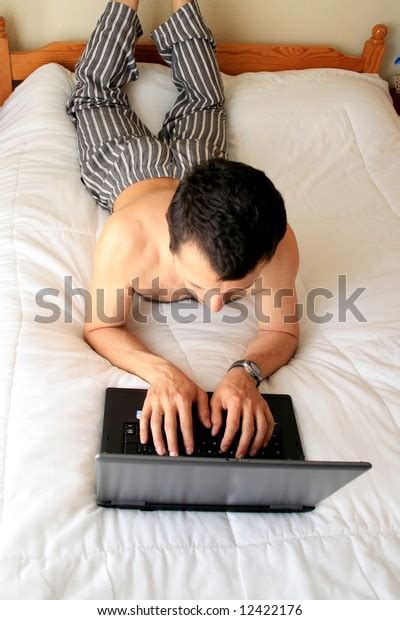 Man On Working On Laptop Bed Stock Photo (Edit Now) 12422176