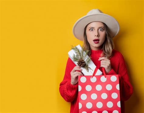 Premium Photo Woman In Red Sweater With T Box And Shopping Bag