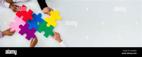 Group Of Businesspeople Solving Jigsaw Puzzle Stock Photo Alamy