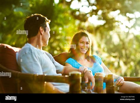 Mature Couple Sitting In Armchairs And Smiling Stock Photo Alamy