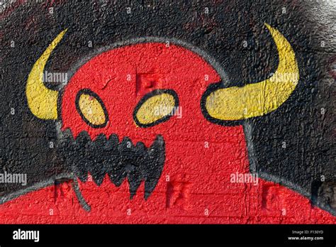 Red monster with yellow horns, fantasy figure, graffiti, street art, Duisburg, North Rhine ...