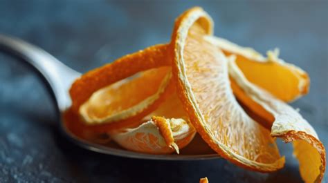 Dried Orange Peel On A Spoon Background Dried Orange Peel Background