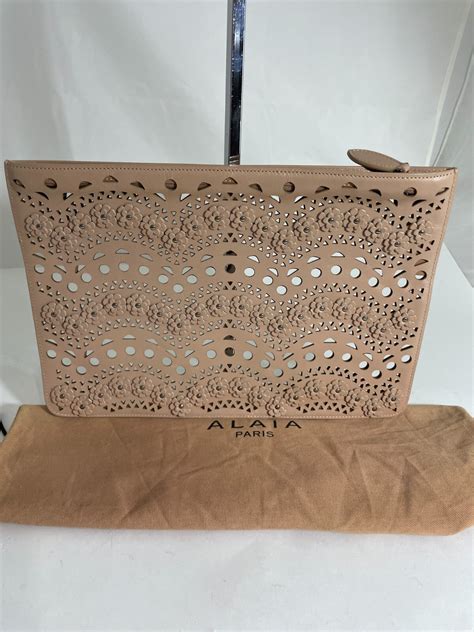 ALAIA LASER CUT NUDE NEUTRAL CLUTCH Gem