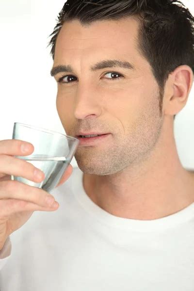 Bust Shot Of Man Drinking Glass Of Water Stock Photo By Photography33