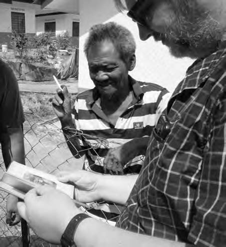 In a Jahai/Semang village, checking photos in Šebesta's first, 1927b ...