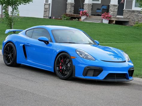 A 2022 Porsche 718 Cayman GT4 Just Became Available Bidders Are