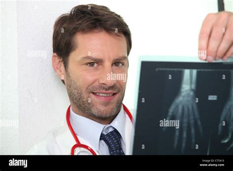 Doctor Examining X Ray Image Of Hand Stock Photo Alamy