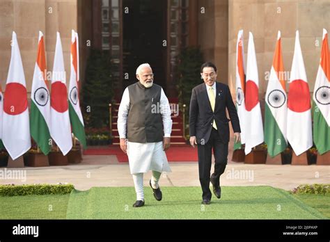 Indian Prime Minister Narendra Modi R Greets His Japanese Counterpart