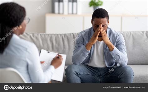 Desperate Black Man Suffering From Nevrous Breakdown Or Depression Having Session At