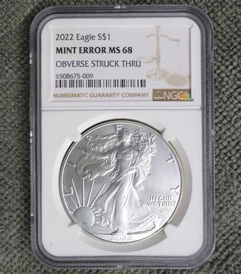 2022 NGC MS 68 Obverse Struck Thru Mint Error Silver Eagle Dollar