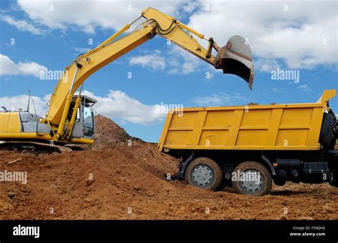 Excavator Loading Dumper Truck Stock Photo Alamy