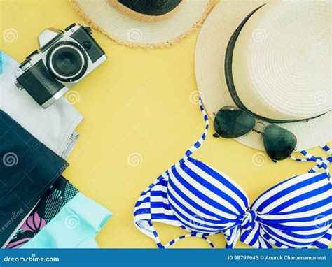 Flat Lay For Blue Bikini Girl Summer Cloth And Accessories Concept With Yellow Background And