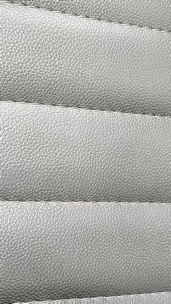 Premium Photo | A close up of a white leather textured fabric.