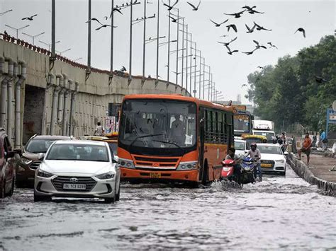 A Waterlogged Road Delhi Heavy Rains Lash City Roads Waterlogged