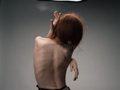 Nude Woman Touches Herself With Hands On A Light Background Model Cropped View Stock Image