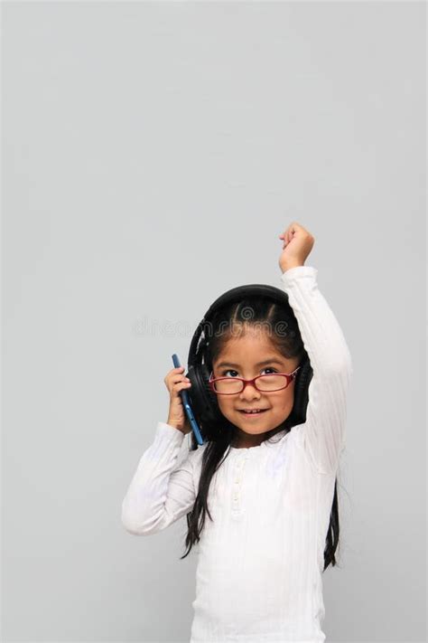 Year Old Brunette Latin Girl With Glasses Listens To Music In Her Headphones Connected To Her
