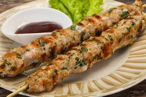 Premium Photo Minced Pork Skewer Kebab With Sauce