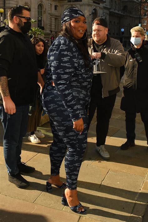 Lizzo Embraces Logomania In Yitty Mules With Boyfriend Myke Wright