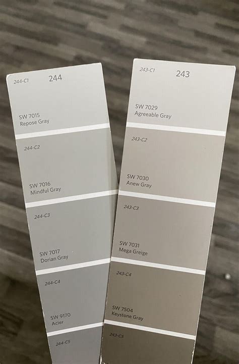 Two Shades Of Gray Paint Sitting Next To Each Other On A Wooden Floor