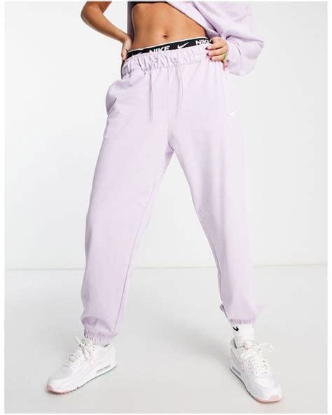 Nike Mini Swoosh Oversized High Rise Trackies In Lilac Purple Lyst