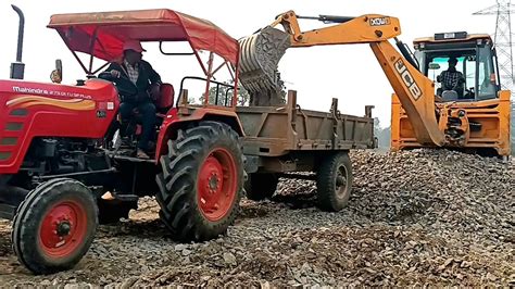 Jcb Dx Working With Many Tractors Stone Loading Mahindra Arjun