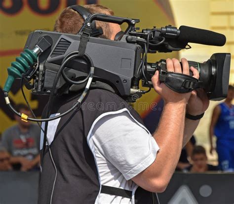cameraman  work    soccer game editorial image image