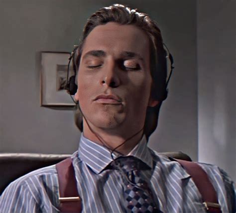 A Man With His Eyes Closed Wearing Headphones