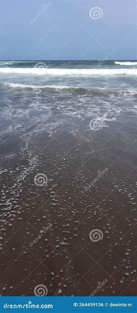 Big waves on the beach stock photo. Image of mudflat - 264459136