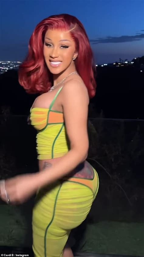 Cardi B Stuns In A Skintight Neon Yellow And Orange Bustier And Skirt