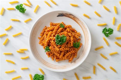 Premium Photo Spiral Or Spirali Pasta With Tomato Sauce And Parsley