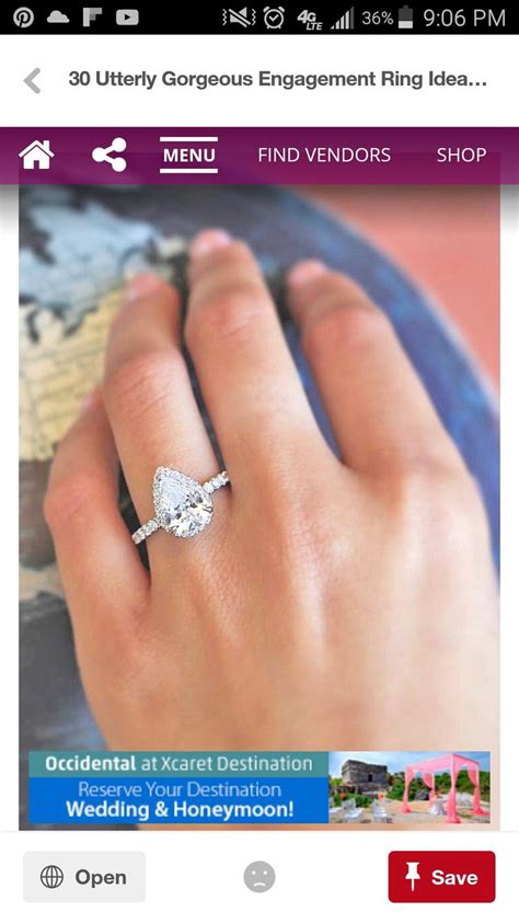 A Person S Hand With A Diamond Ring On Top Of Their Finger And The