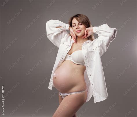 Pregnant Girl In Lingerie With A Naked Tummy Woman In A Pregnancy Shirt Gentle Soft Feminine