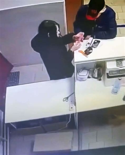 Woman Tries Out Sex Toy At Store Counter