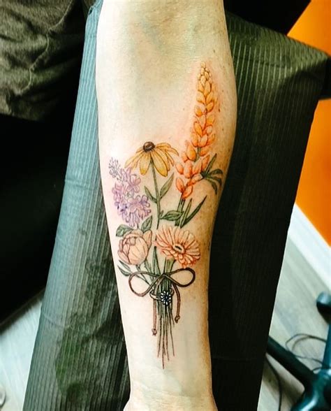 Natural color tattooFlower tattooBouquet with ringForearm flower tattoo ...