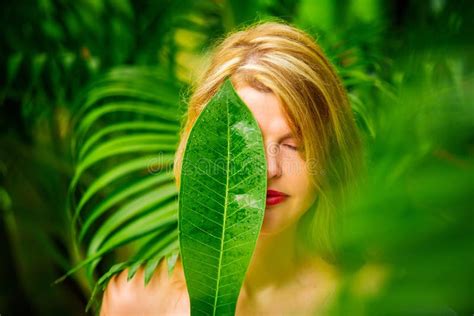 Woman Holding Green Leaf In Front Of Her Face Stock Photo Image Of