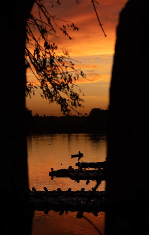 Free Picture Silhouette Of Fishing Boat In Distance In Orange Yellow