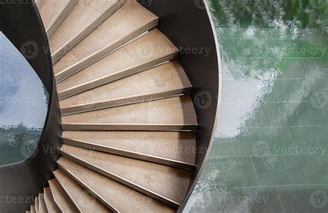 Upside view of a spiral staircase pattern. Spiral stairs circle in ...