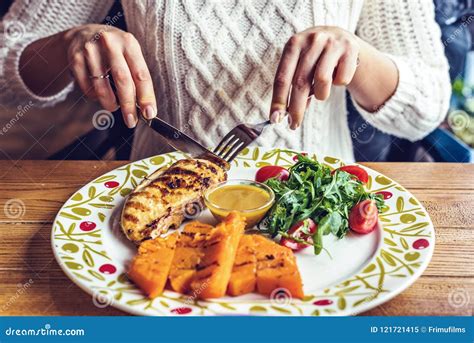 Woman Eating Grilled Chicken Breast With Sauce Stock Image Image Of