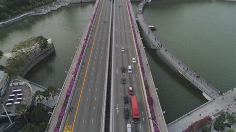 Singapore - 25 September 2018. Aerial for Singapore with many cars on the bridge above the lake ...