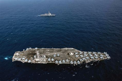 Ronald Reagan Carrier Strike Group JMSDF Sail Together In Western