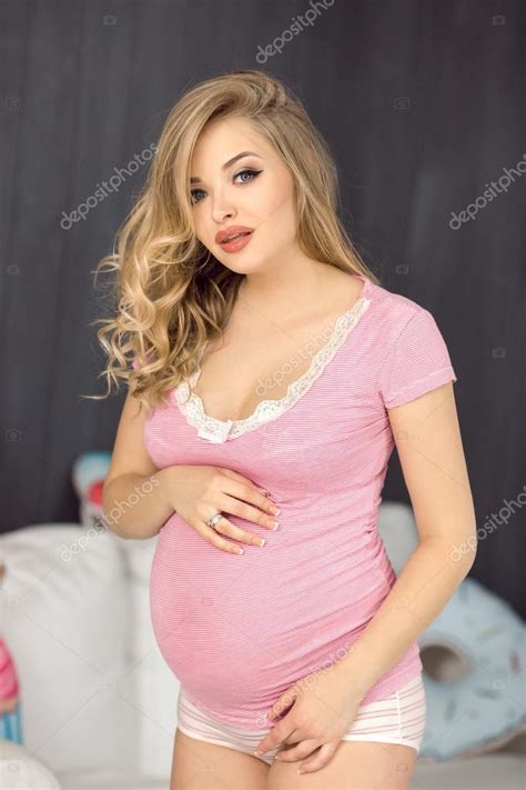 Happy Pregnant Woman Posing In Pink Blouse Attractive Young Blonde