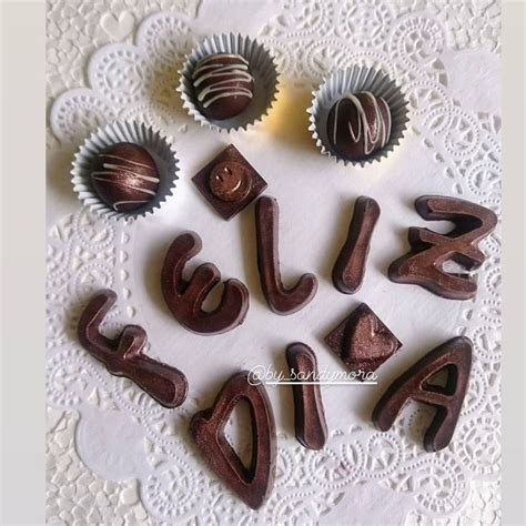 Chocolates Are Arranged In The Shape Of Letters And Numbers On A Doily