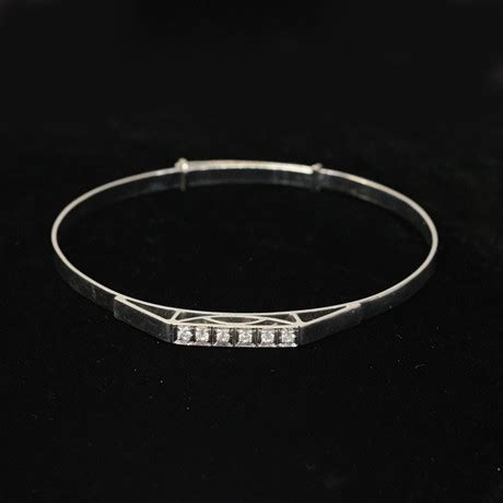 ARMRING K VITGULD SEX SLIPADE STENAR MALMÖ Smycken Ädelstenar Armband Auctionet