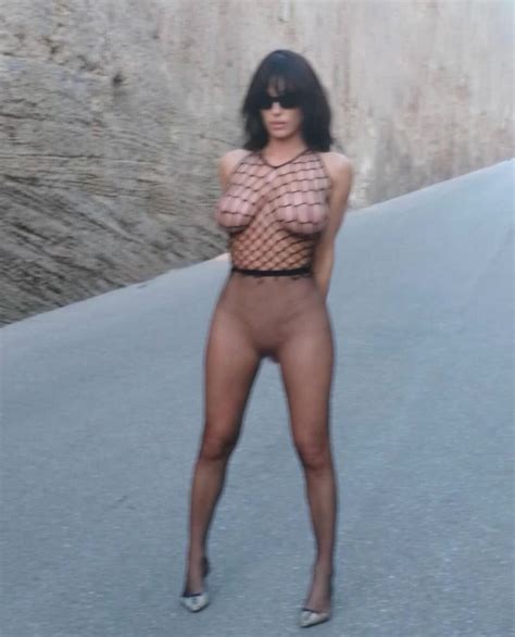 Bianca Censori Goes Nearly Naked On Instagram In A Fishnet Top And Sheer Tights