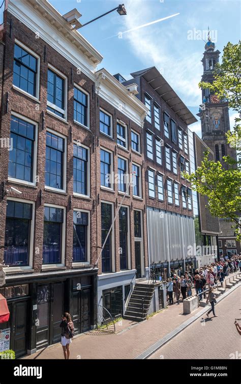 Anne Frank House And Anne Frank Museum And Entrance With Tourists In