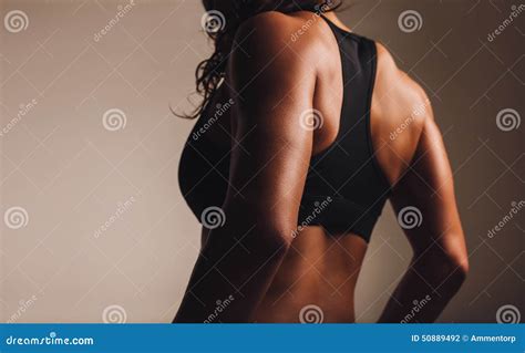 Back Of A Fit Woman Athlete In Sports Bra Stock Photo Image