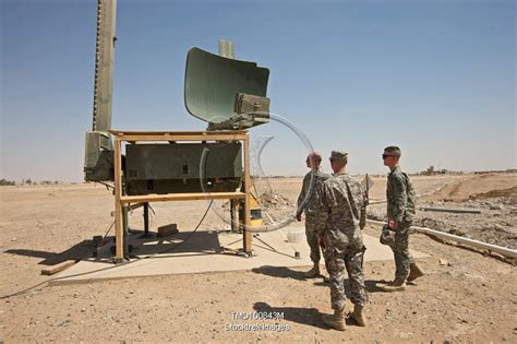 Soldiers Checking A Radar System At A Military Base In Iraq