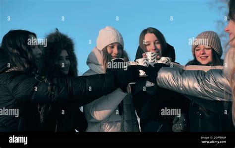 A Group Of Girls Are Drinking Hot Tea In Winter Stock Photo Alamy